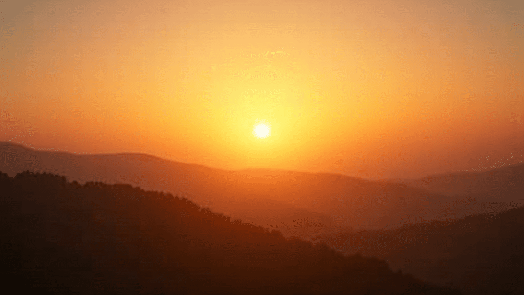 Sunrise over peaceful landscape, symbolizing hope and positive change